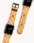 The Brown Flower Check Vegan Leather Apple Watch Bands, available in vibrant orange and yellow floral-inspired checker patterns, rest against a light background. Their simple clock face enhances the playful, retro aesthetic. Crafted with eco-conscious materials, these bands seamlessly blend style with sustainability.