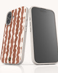 Two Cocoa Wave Stripe Eco-Friendly Biodegradable Phone Cases, one showing the back with a brown and white wavy stripe pattern and the other showing the empty front screen.