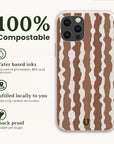 The Cocoa Wave Stripe Eco-Friendly Biodegradable Phone Case features a brown and white wavy stripe pattern, 100% compostable materials, water-based inks, local fulfillment, and shock-proof protection.