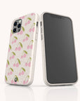 Pink Cherries compostable phone case on iPhone 14 highlighting sweet cherry design and sustainable material.