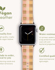 Displayed is the Pink and Purple Gingham Vegan Leather Apple Watch Band, featuring a pink and beige gingham design. The text highlights its attributes: cruelty-free, water-resistant, made to order, and certified quality. Accompanied by a leaf icon and description, it emphasizes environmentally conscious production.
