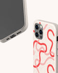 Pink and Red Swirls biodegradable phone case displayed on Samsung Galaxy S24 with artistic swirl pattern.