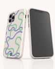 Purple and Green Swirls compostable phone case fitted on iPhone 14 highlighting expressive swirl pattern and sustainable matte finish.