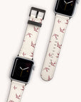 The Swallows Vegan Leather Apple Watch Band features a cream bird-themed strap and minimalist clock face with orange and yellow hands. This eco-friendly accessory promises style and sustainability using vegan leather on a light background.