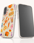 Sustainable iPhone 13 case with vibrant fruit illustration, made from plant-based materials.
