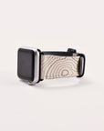 The Terrain Vegan Leather Apple Watch Band, with a silver case, features a unique strap crafted from eco-friendly vegan leather and boasts a grayscale topographic map design on a simple white background.