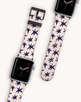 The Wonky Stars Vegan Leather Apple Watch Band set features two smartwatches with vegan leather straps, adorned with black star patterns. The watch faces have a simple clock design with orange hands on a black background, against a light gray backdrop, ideal for any collection.