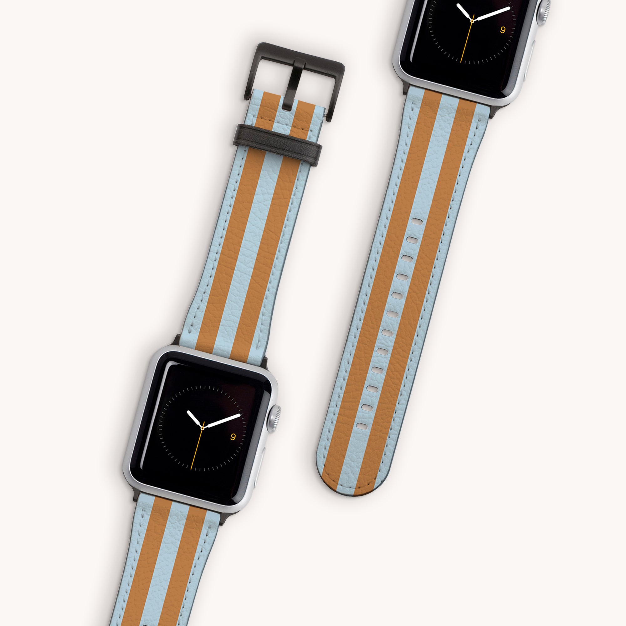 Two elegant smartwatches with Brown and Blue Stripes Vegan Leather bands; one displays the time while the other lacks a display. Laid flat, they showcase their timeless elegance, compatible with Series 1 to 10.