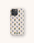 The Sunny Side Up Eco-Friendly Phone Case, in beige with a cactus and purple flower pattern accented by small yellow stars, is displayed on a light background.