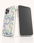 Two Purple and Green Swirls Eco-Friendly Biodegradable Phone Cases, each featuring a speckled off-white base adorned with abstract wavy designs in green, blue, and purple. One case highlights the vibrant back artwork with striking purple and green swirls, while the other shows the front of a phone within the eco-friendly case.