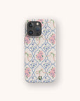The Pink Ribbons Eco-Friendly Biodegradable Phone Case features pink, blue, and green floral ribbons on white, made from eco-friendly materials with a small horseshoe symbol at the bottom.