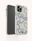 Introducing the Purple and Green Swirls Eco-Friendly Biodegradable Phone Case: a beige phone case adorned with wavy green and purple lines, designed with a smooth, subtly speckled texture. This snug-fitting case is made from biodegradable materials and features precise camera and button cutouts.
