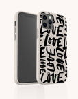 A smartphone in the Love Words Eco-Friendly Biodegradable Phone Case, featuring the word “LOVE” repeatedly written in bold black letters in various orientations on a beige background.
