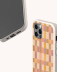 Two beige phone cases, one showing the front and one the back. The back features a pink and purple watercolour design. Both cases have precise cutouts for the camera, buttons, and ports, making this Pink and Purple Watercolour Eco-Friendly Phone Case a stylish and sustainable choice.