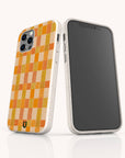 Two smartphones in eco-friendly Green and Orange Watercolour Checker phone cases are displayed upright on a white background; one shows the yellow and orange checkerboard back, while the other displays the front screen.