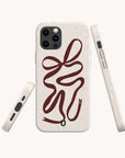 Three beige, eco-friendly Brown Bow Ribbon Phone Cases shown from various angles, each with a brown abstract line design resembling a snake and a small green section near the bottom on the back.