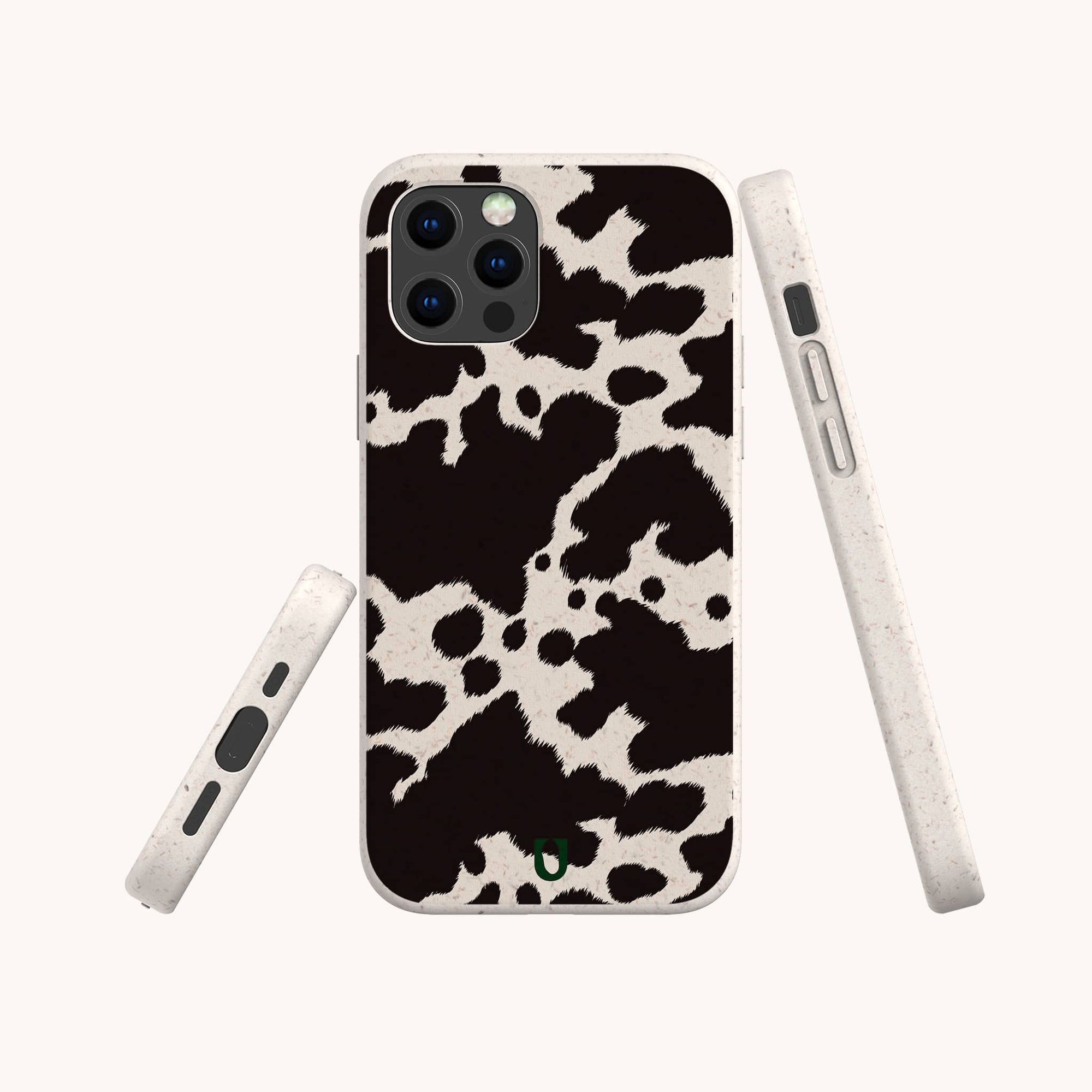 The Cow Print Eco-Friendly Phone Case is displayed from the back and sides, showcasing its texture and button cutouts. Compatible with iPhone and Samsung Galaxy, this stylish accessory blends eco-consciousness with functionality.