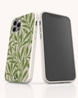 Two smartphones in white Willow Eco-Friendly Phone Cases with green leaf designs—one shows the patterned back and camera lenses, the other a blank screen. This sleek, rounded case fits iPhone and Samsung Galaxy models.