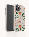 The Sun and the Moon Eco-Friendly Phone Case is a compostable phone case featuring a mystical, celestial design with suns with faces, crescent moons, stars, and green snakes on a light background, shown on a smartphone.
