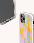 Two smartphones with beige Bubble Gum Eco-Friendly Phone Cases are shown; one has a pastel pink, yellow, and blue abstract pattern, while the other displays the phone’s screen and ports for full compatibility.