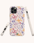 The Flower Strokes Eco-Friendly Phone Case features abstract floral brushstrokes in purple, orange, and red on a white background with a small green logo. Shown from multiple angles. Compatible with iPhone and Samsung Galaxy models.