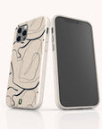 Two smartphones are displayed: one reveals the back featuring the Abstract Swirling Lines Eco-Friendly Phone Case in beige, adorned with black abstract swirling lines, while the other shows the front with a blank screen. This minimal and modern case design is compatible with both iPhone and Samsung Galaxy models.