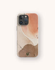 A smartphone features the Pink and Brown Watercolour Eco-Friendly Phone Case, showcasing an abstract beige, brown, and peach watercolor design with a small green "U" at the bottom center. The phone sits centered on a light background.