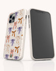 Two smartphones display the Bows Eco-Friendly Biodegradable Phone Case, decorated in white with a vibrant pattern of pink, orange, purple, and green bows. One phone showcases the screen, while the other highlights the eco-friendly case’s colorful back design.
