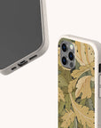 Two Flower Garden Eco-Friendly Phone Cases in biodegradable beige: one displays the screen and ports, the other shows a leafy green and yellow pattern. Compatible with iPhone and Samsung Galaxy models.