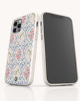 Two smartphones featuring the Pink Ribbons Eco-Friendly Biodegradable Phone Case in white, adorned with a pink and green floral pattern accented by blue. These stylish, eco-friendly cases help minimize environmental impact. One phone displays the back to showcase the vibrant design, while the other reveals its blank black screen.