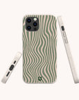 The Green Distorted Lines Eco-Friendly Phone Case is displayed from the back, side, and bottom against a light background, highlighting its sustainable design with wavy green and beige striped patterns. This case features precise cutouts for the camera, buttons, and ports, and is compatible with both iPhone and Samsung models.