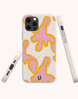 The Pink Abstract Flowers Eco-Friendly Phone Case features a speckled beige background with abstract pink shapes outlined in yellow, shown from back, side, and bottom views. Made with climate-positive materials, it has a black "U" logo at the bottom center.