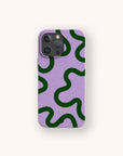 The Purple and Green Swirl Eco-Friendly Biodegradable Phone Case features a playful wavy green pattern on a light lavender background, offering a plant-based, sustainable option for your smartphone.