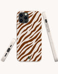 The Brown Zebra Eco-Friendly Phone Case features a brown and white zebra stripe pattern, shown from the back and sides on a plain light background. This biodegradable case fits iPhone and Samsung Galaxy with precise cutouts for buttons, camera, and ports.