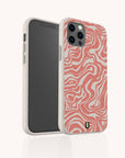A smartphone is displayed from both the front and back against a plain background, featuring the Pink Marble Swirl Eco-Friendly Phone Case—a white biodegradable case adorned with abstract pink wavy patterns.