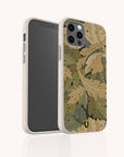 The Flower Garden Eco-Friendly Phone Case, shown on a smartphone front and back, features a green, tan, and brown leaf pattern, a small green U-shaped logo near the bottom, and fits iPhone and Samsung Galaxy models.