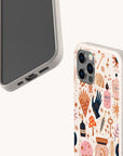 Two smartphones in speckled beige cases; one case—a Love Spell Eco-Friendly Phone Case—features a whimsical, colorful design with hands, stars, bottles, crystals, and plants, while the other remains plain. Set against a white background. Ideal for those embracing zero-waste living.