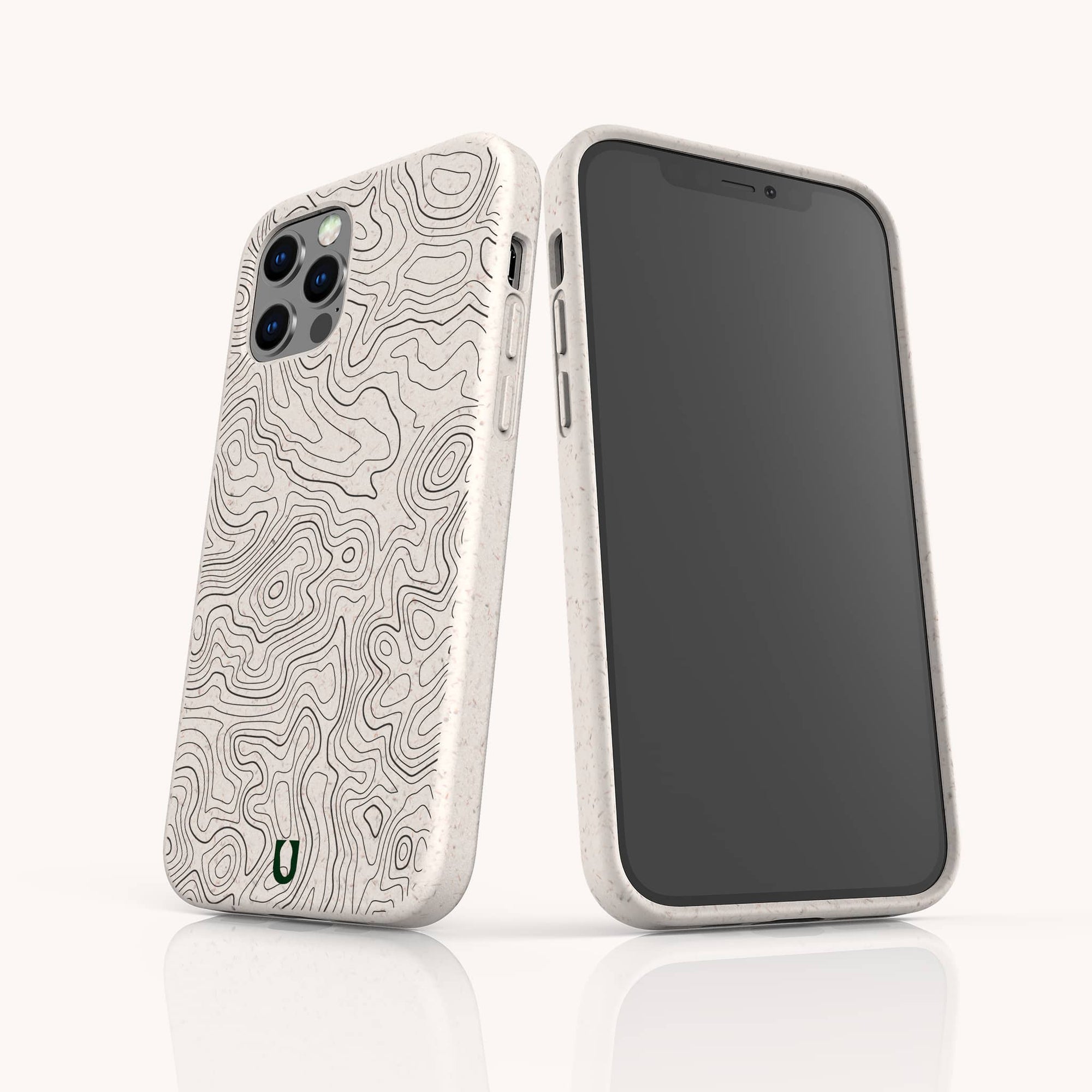 Two smartphones with beige Terrain Lines Eco-Friendly Phone Cases display a raised topographic map pattern; one shows the patterned back with a small green “U” logo, the other the screen. The cases are made from plant-based materials.