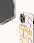 Two smartphones with the Purple and Yellow Swirls Eco-Friendly Biodegradable Phone Case in off-white, featuring artistic abstract wavy yellow and purple lines, are displayed. One phone displays the screen and charging port, while the other shows the back and camera area.