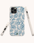 Three views of the Blue Coral Eco-Friendly Phone Case, featuring a marine-inspired blue coral pattern on a white background, shown from the back, side, and bottom. This biodegradable phone case includes precise cutouts for the buttons, camera, and charging port.