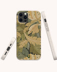 Showcased from three angles—back, side, and bottom—the Flower Garden Eco-Friendly Phone Case features a green, tan, and yellow leaf pattern on an off-white background. A small green horseshoe logo is positioned at the bottom center of the case, emphasizing its thoughtful design.