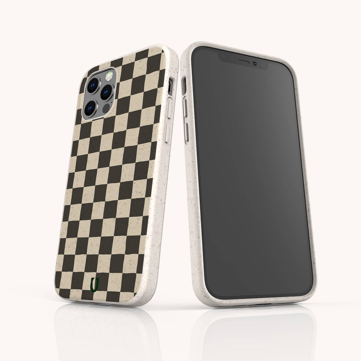 Two smartphones in light speckled cases; one features the Black Checker Eco-Friendly Phone Case with a black-and-beige checkerboard pattern on the back, while the other displays a blank black screen.