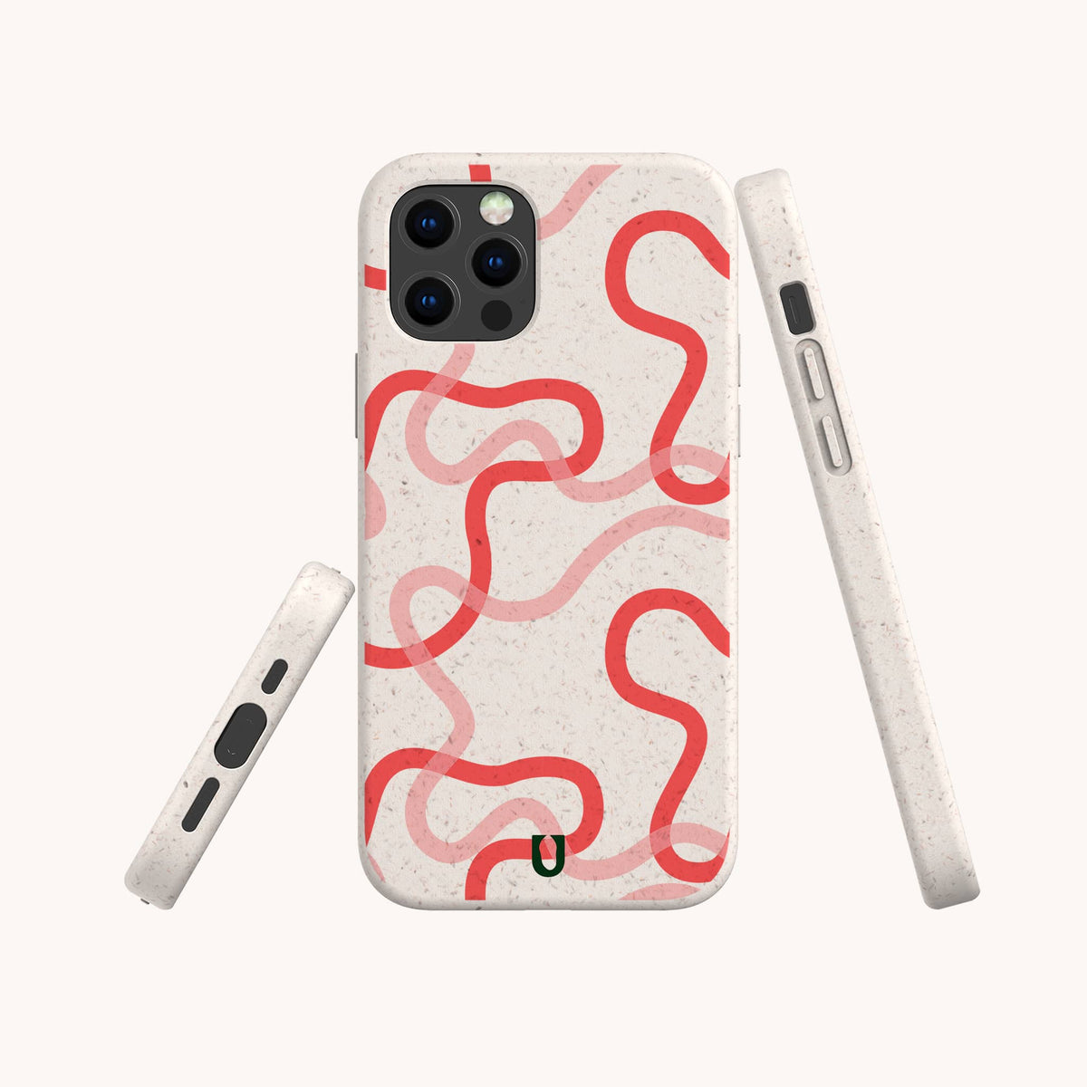 Three views of the Pink and Red Swirls Eco-Friendly Biodegradable Phone Case on a smartphone, showcasing its beige speckled, plant-based material and bold and thin wavy red lines looping across the back, photographed against a plain light background.