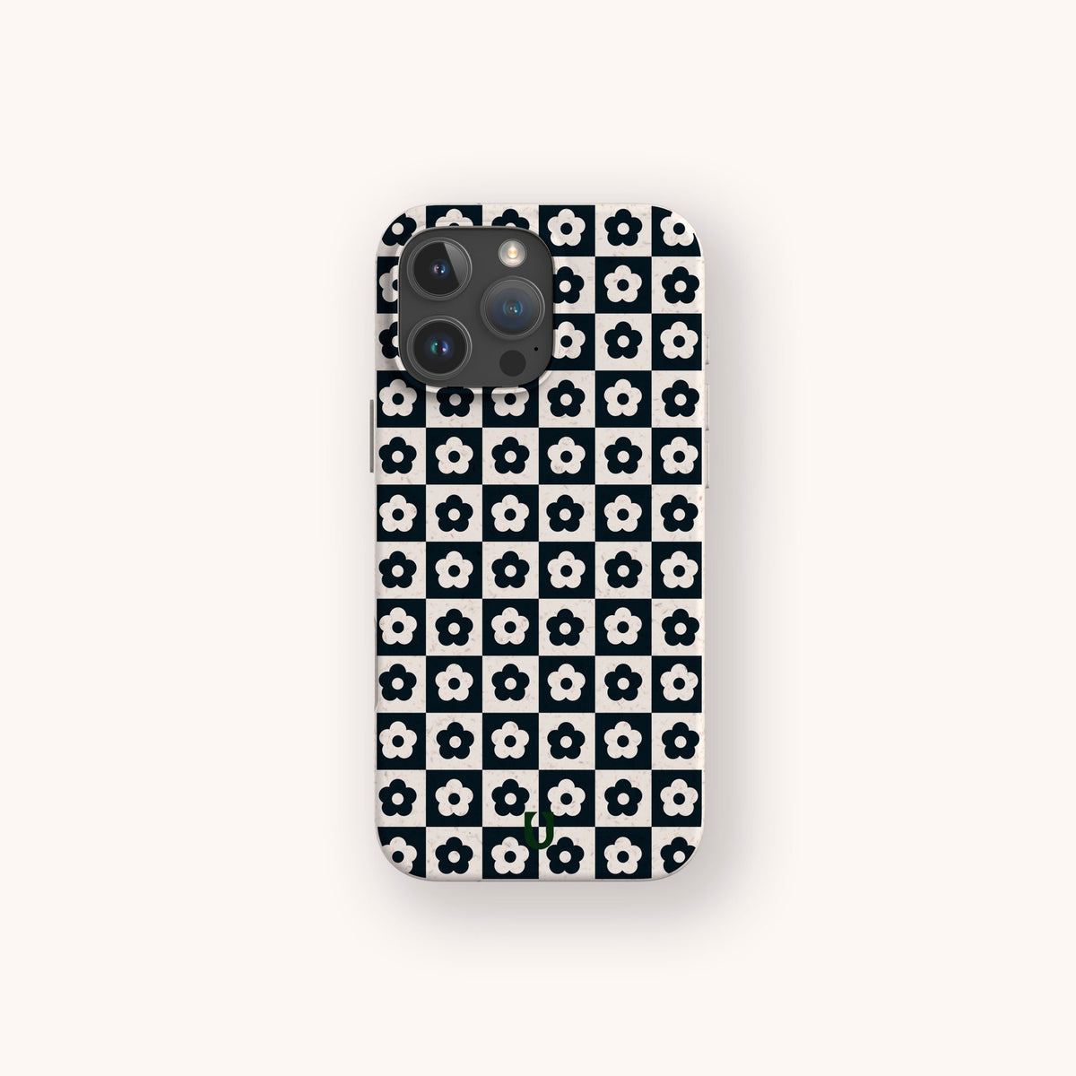 Centered on a light background, the Black Flower Checker Eco-Friendly Phone Case is displayed on a smartphone. The case features a black and white grid pattern with each square containing a simple white flower with a black center.