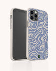 The Blue Marble Swirl Eco-Friendly Phone Case is shown in beige and blue with wavy abstract lines, displayed at an angle to highlight both the front screen of the smartphone and the back of the case.