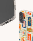 Showcasing our Monkey See Monkey Do Eco-Friendly Biodegradable Phone Case collection, two phones with beige cases catch the eye—one with a simple screen, the other displaying a vibrant tiled design featuring charming illustrations of animals and plants such as a tiger, snake, palm tree, and playful pink and blue borders. Each biodegradable case offers stylish protection for your device while supporting sustainability.