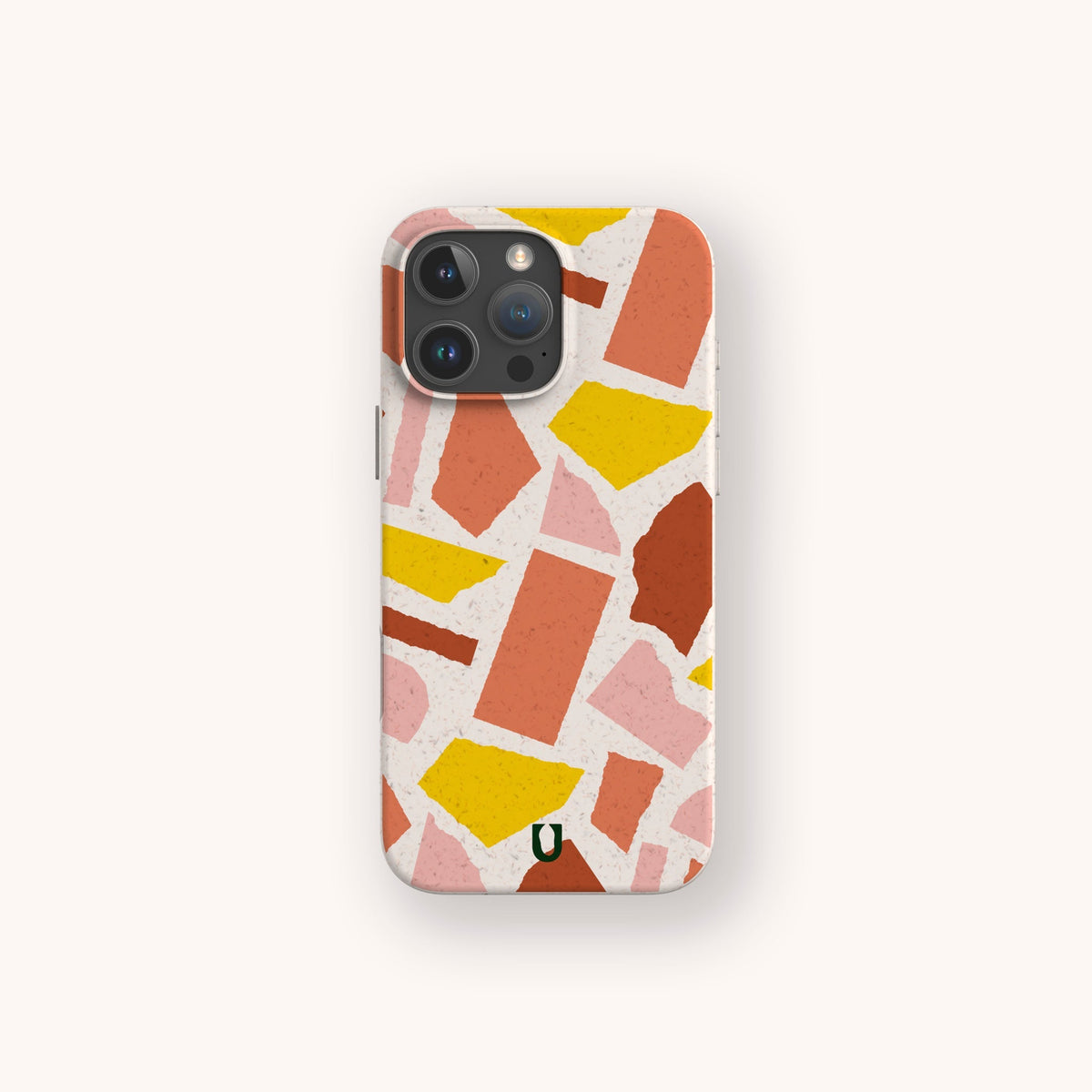Introducing the Paper Scraps Eco-Friendly Biodegradable Phone Case—a stylish smartphone case featuring an abstract terrazzo pattern with pink, yellow, and orange shapes on a light background, thoughtfully designed for those who value both sustainability and modern design.