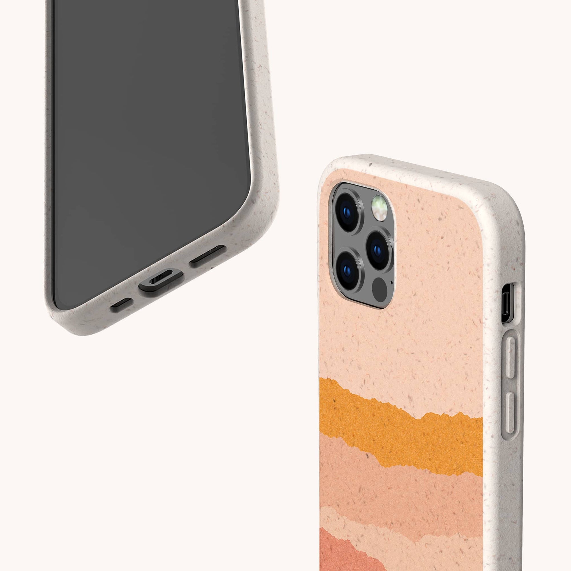 Two smartphones in speckled beige Valleys Eco-Friendly Phone Cases—compatible with iPhone and Samsung Galaxy; one shows the front, the other reveals a compostable wavy, peach-and-orange layered back with highlighted camera lenses and side buttons.
