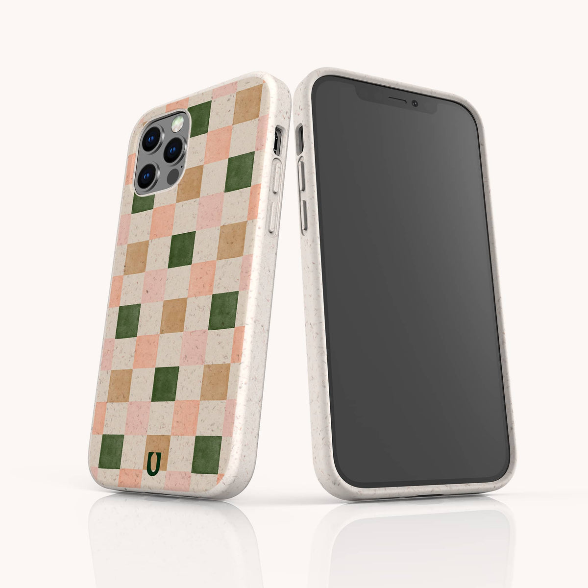 Two smartphones with speckled white cases showcase standout style. One displays the Pink and Green Checker Eco-Friendly Phone Case, featuring a playful pastel checkerboard pattern in pink, green, and beige squares—ideal for those seeking a fashionable and sustainable phone case. The other is turned to show its black screen. Both cases combine contemporary design with earth-friendly materials.