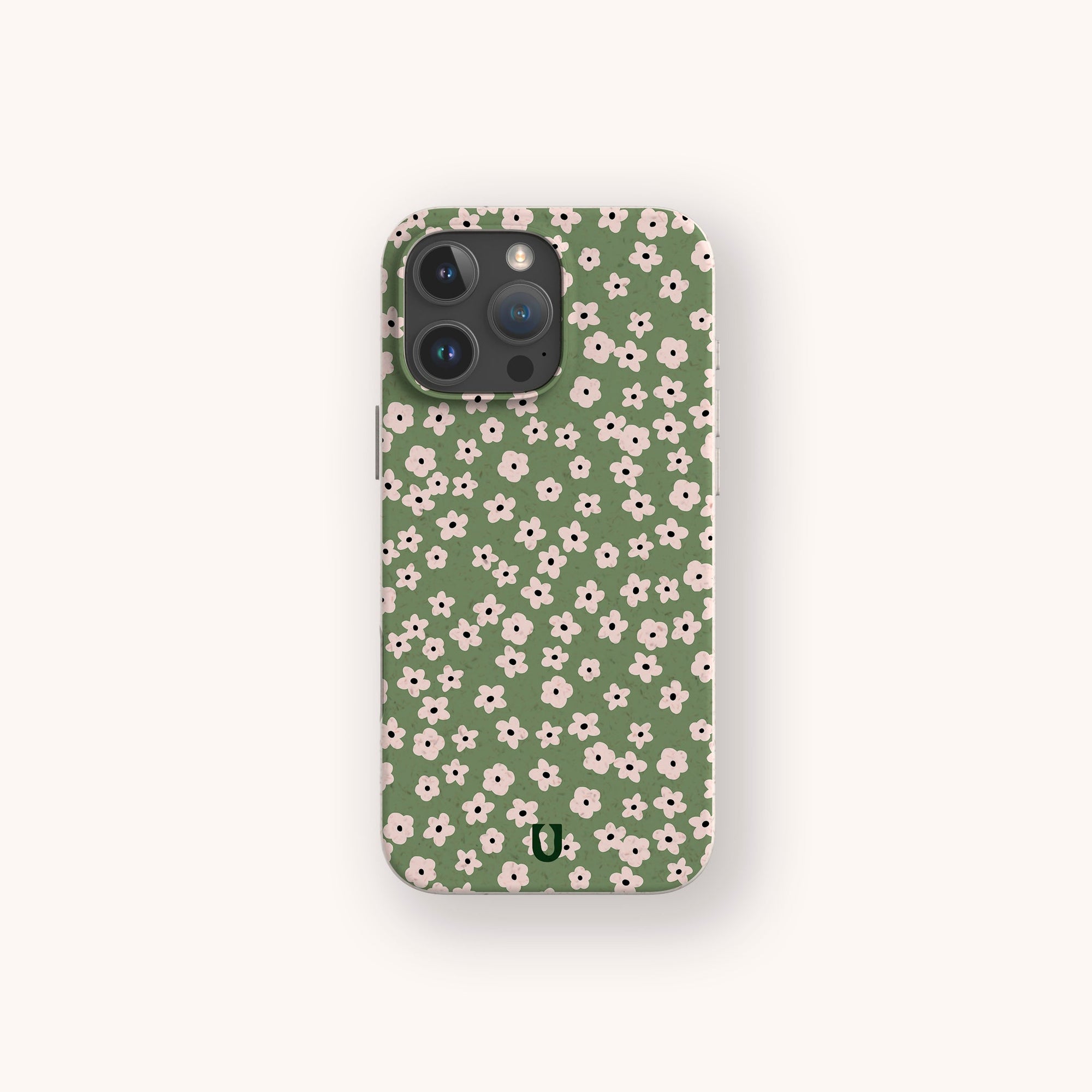The Vintage Green Flowers Eco-Friendly Phone Case, shown on a light beige background, features a green design with small white and pink floral patterns.